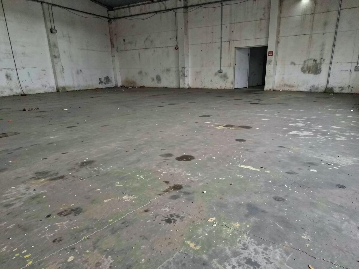 Worn industrial floor before restoration